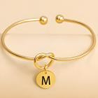 M / Goud